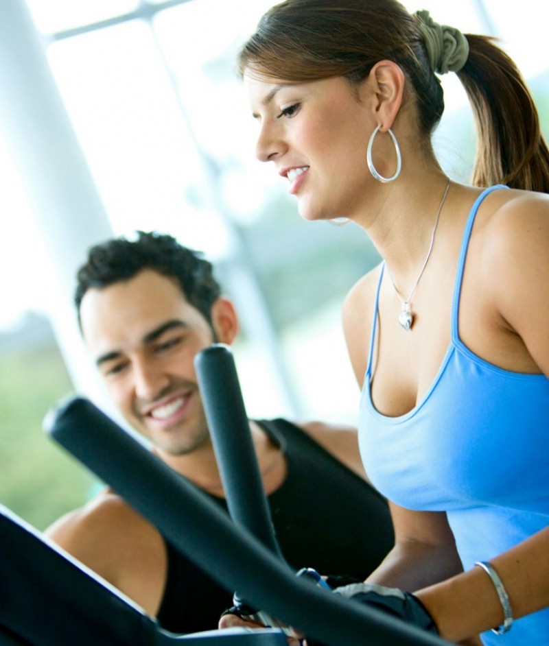 beautiful woman at the gym doing stretching exercise